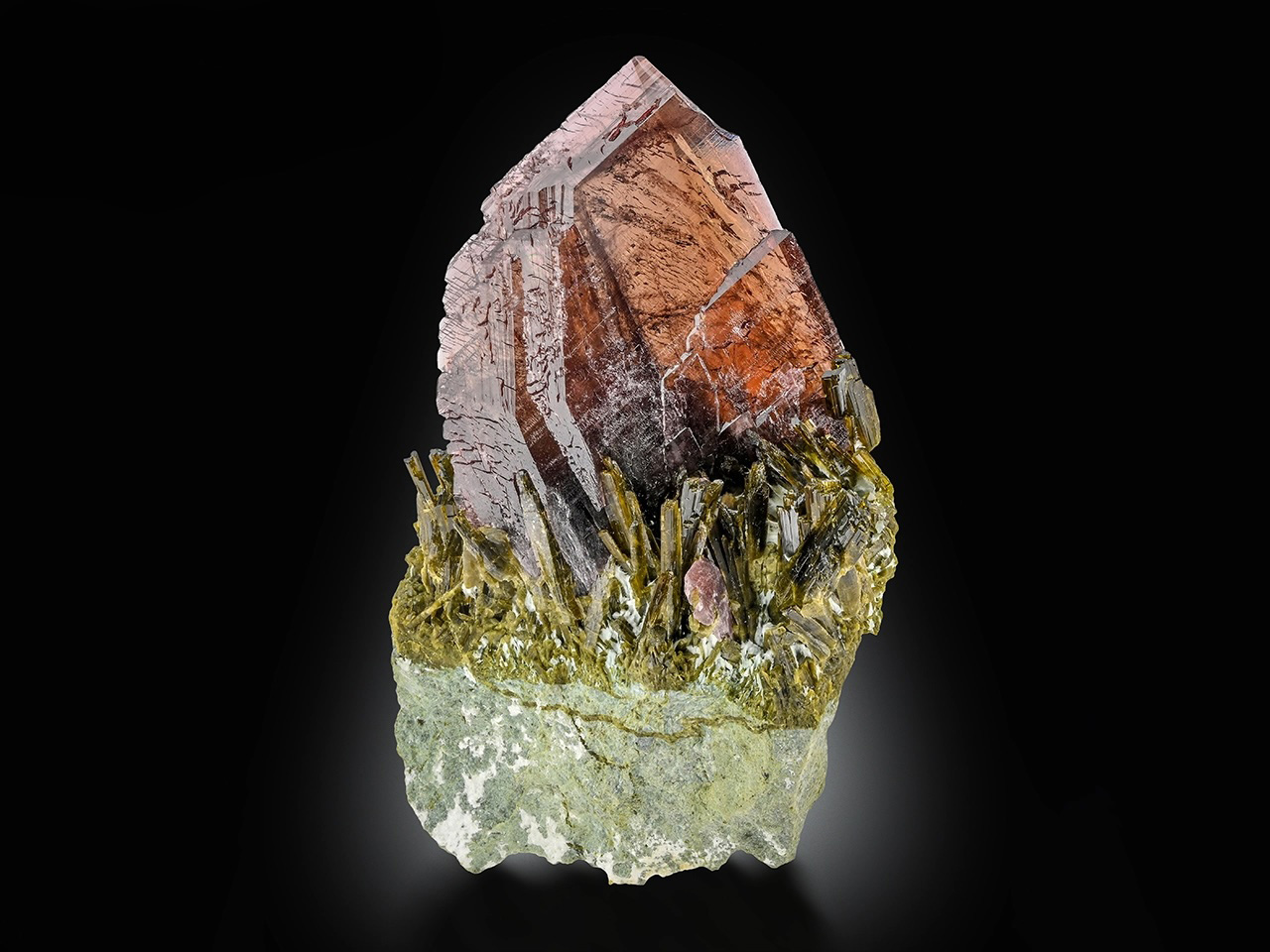 Axinite with Epidote – Lustrous Copper-Brown Gem Crystal Rising from Emerald-Green Epidote Matrix