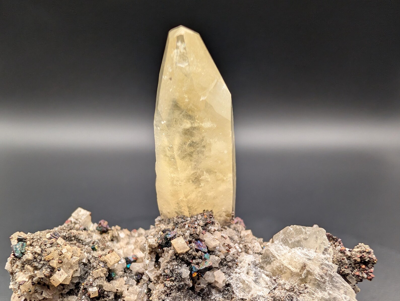 Calcite with Chalcopyrite – Solitaire Honey-Yellow Terminated Crystal on Iridescent Sulfide Matrix