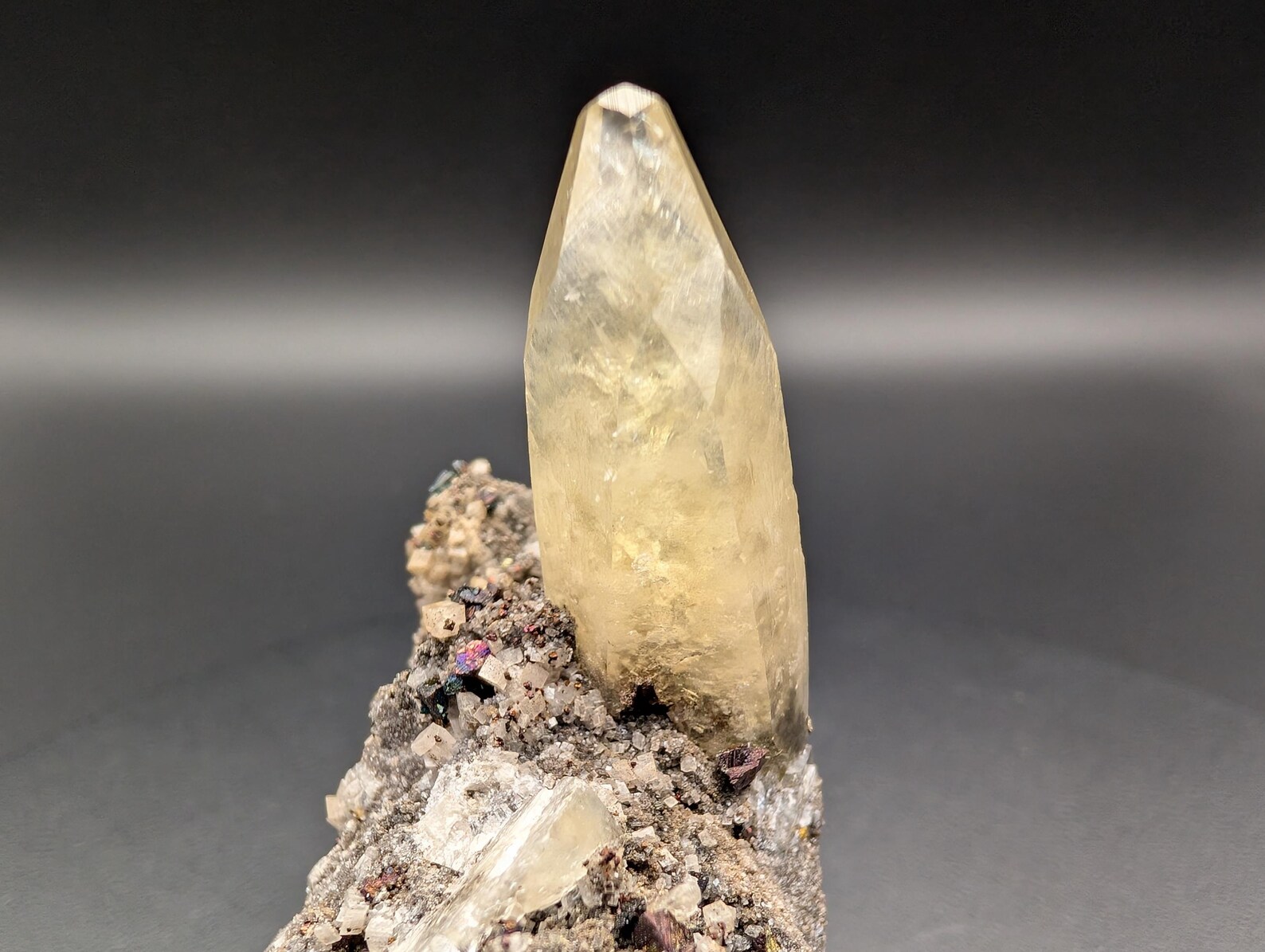 Calcite with Chalcopyrite – Solitaire Honey-Yellow Terminated Crystal on Iridescent Sulfide Matrix
