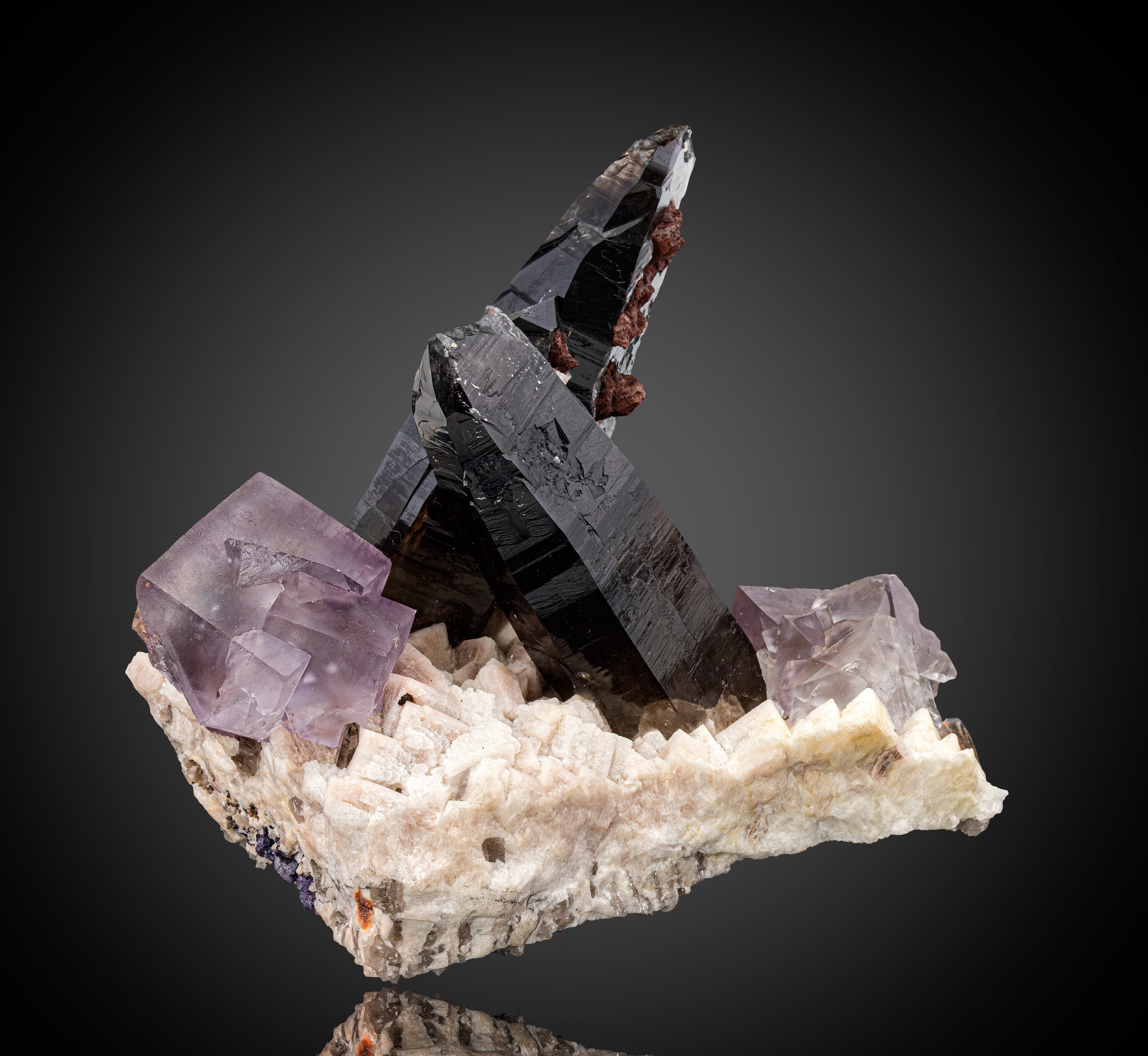 Twinned Fluorite and Smoky Quartz on Feldspar