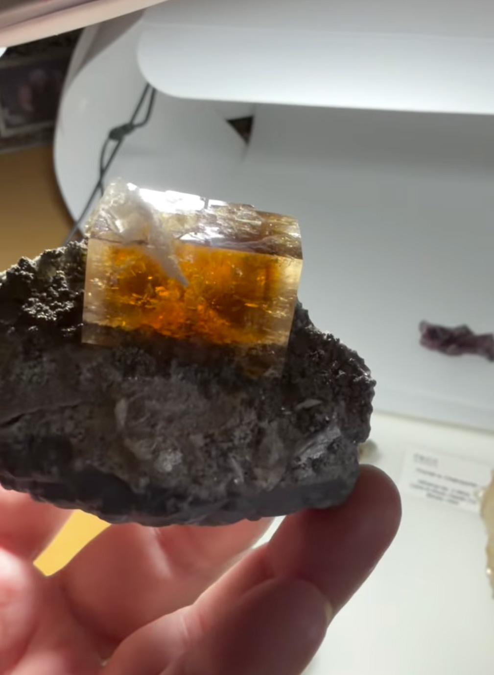 Fluorite with Celestine - Gemmy Amber Cube with Internal Celestine Blade on Carbonate Matrix