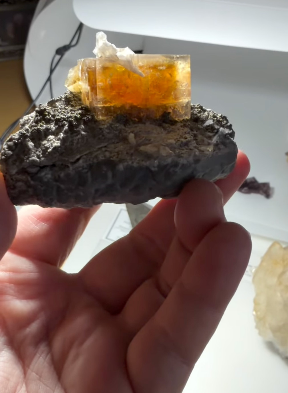 Fluorite with Celestine - Gemmy Amber Cube with Internal Celestine Blade on Carbonate Matrix